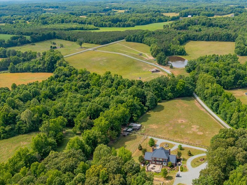 Large Acreage with Brick Home : Liberty : Alamance County : North Carolina